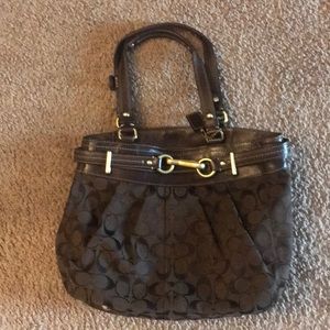 Brown signature Coach small tote bag.